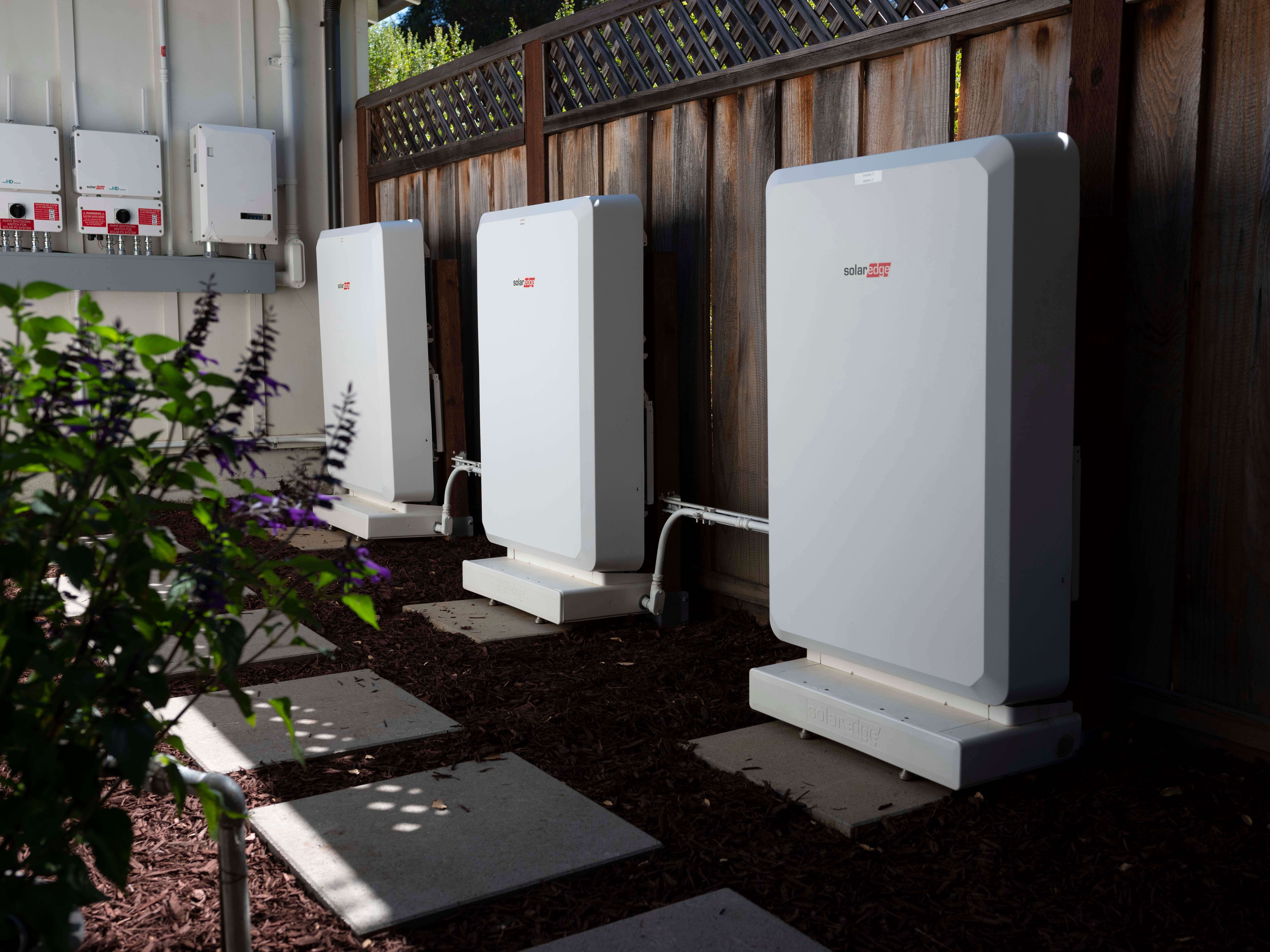 SolarEdge battery and inverter in a home backyard.