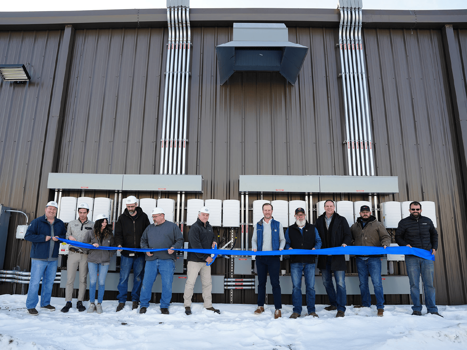 Customers and team members inaugrating new SolarEdge site installation